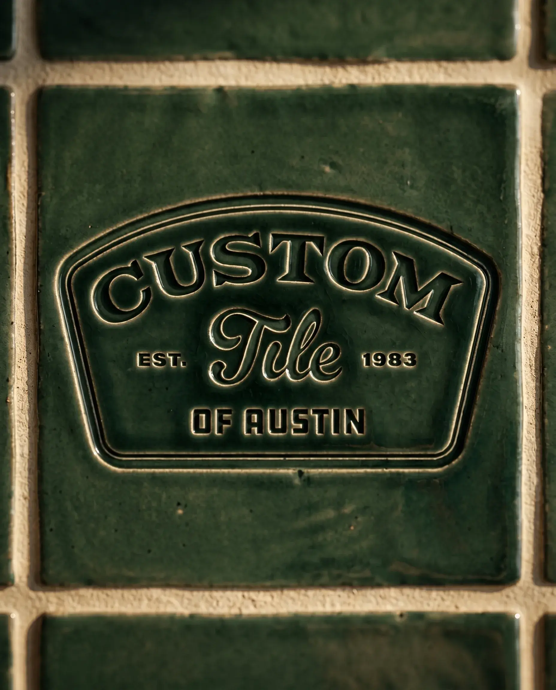 Custom Tile of Austin badge embossed into a green glazed handmade tile