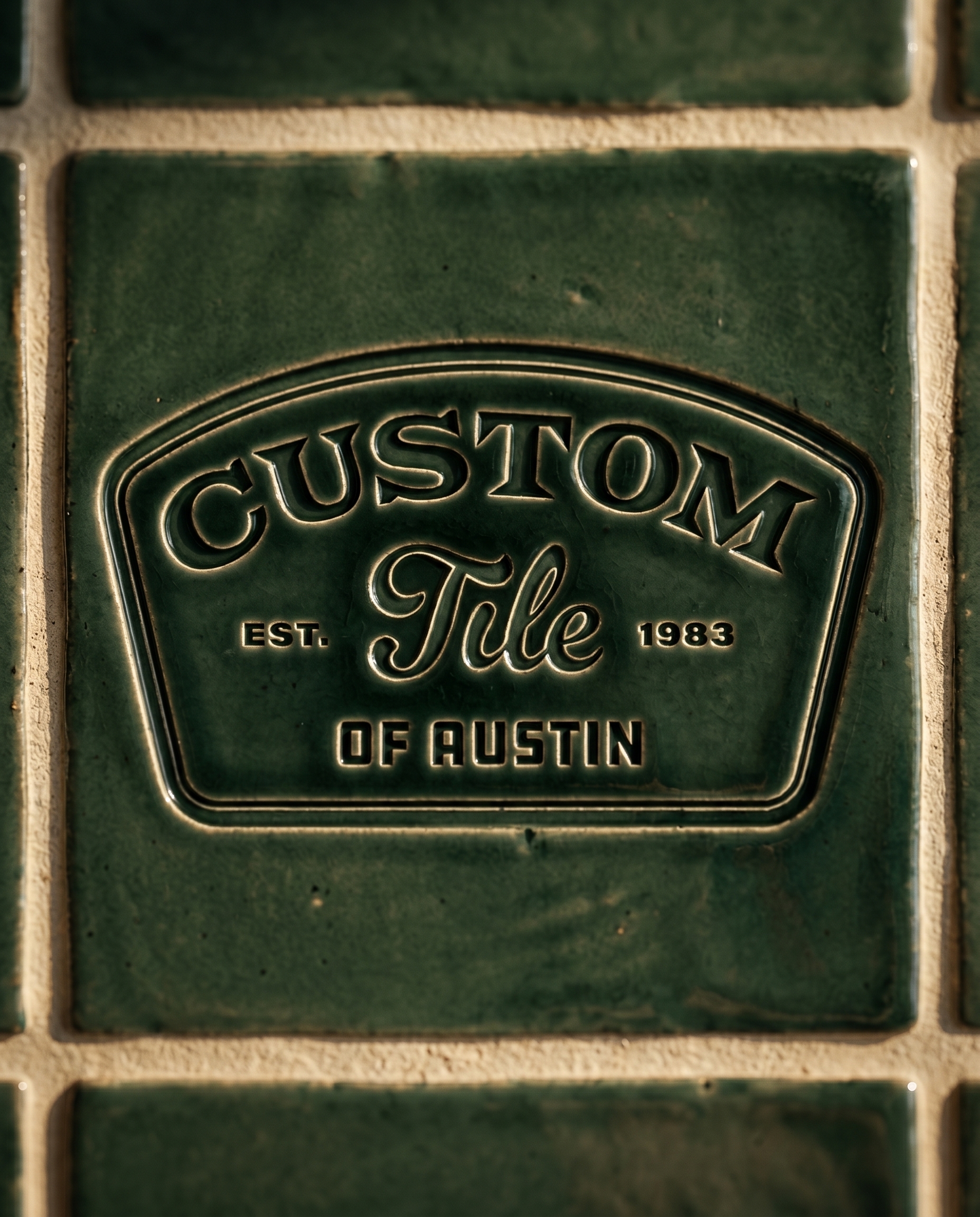 Custom Tile of Austin badge embossed into a green glazed handmade tile